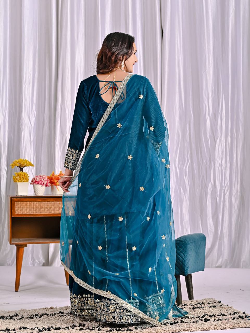 Elegance in Deep Blue Velvet Attire - Image 10
