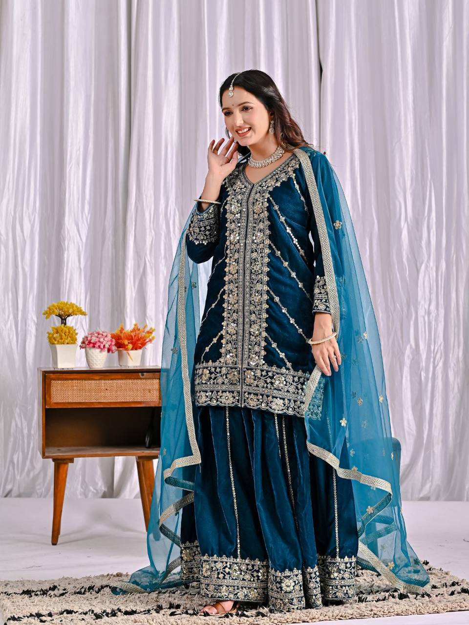 Elegance in Deep Blue Velvet Attire - Image 3
