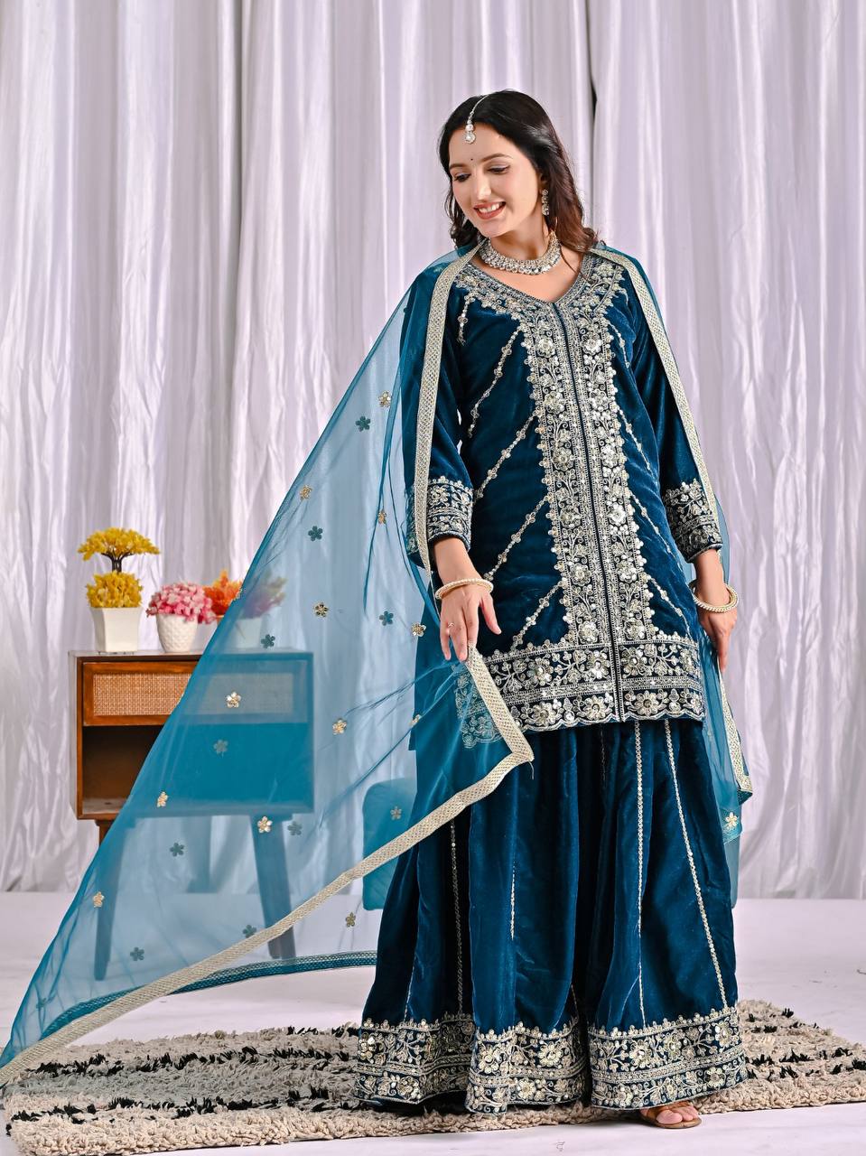 Elegance in Deep Blue Velvet Attire - Image 4