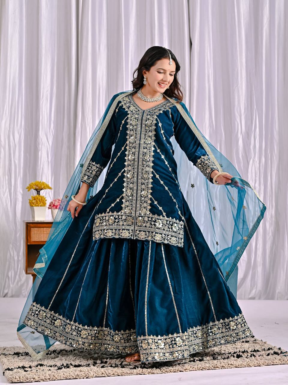 Elegance in Deep Blue Velvet Attire - Image 5