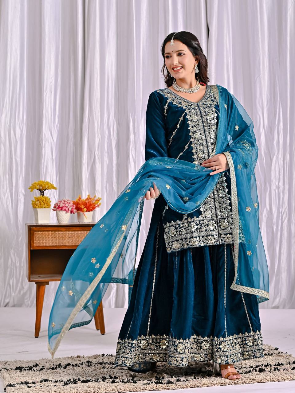 Elegance in Deep Blue Velvet Attire - Image 6