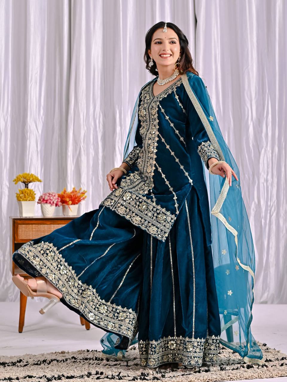 Elegance in Deep Blue Velvet Attire - Image 7