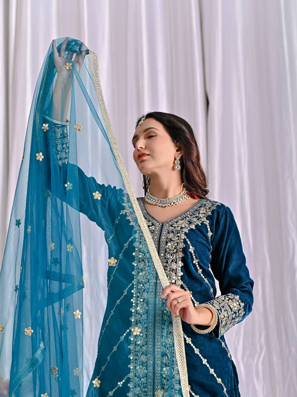 Elegance in Deep Blue Velvet Attire - Image 8