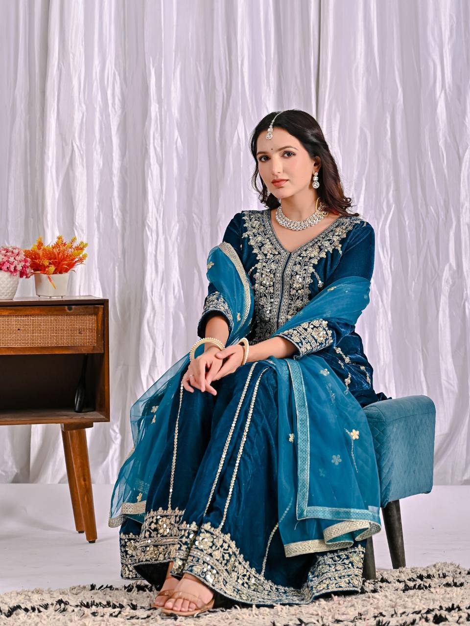 Elegance in Deep Blue Velvet Attire - Image 9